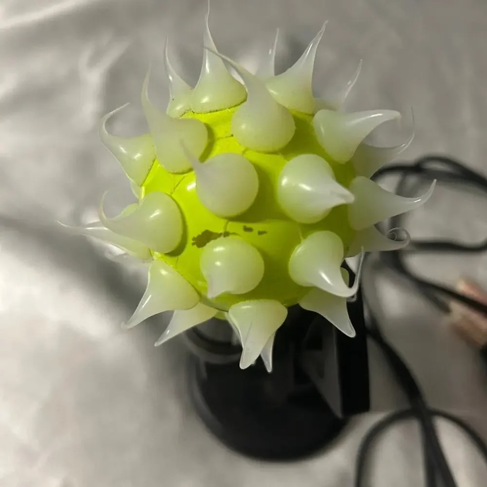 Lady shaped lamp with spikes yellow and purple light bulbs